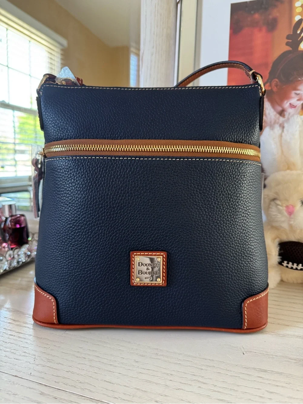 Dooney & Bourke Navy Pebble Leather Crossbody with Brown Trim and Gold Hardware